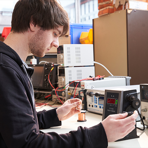 Student working with power supply